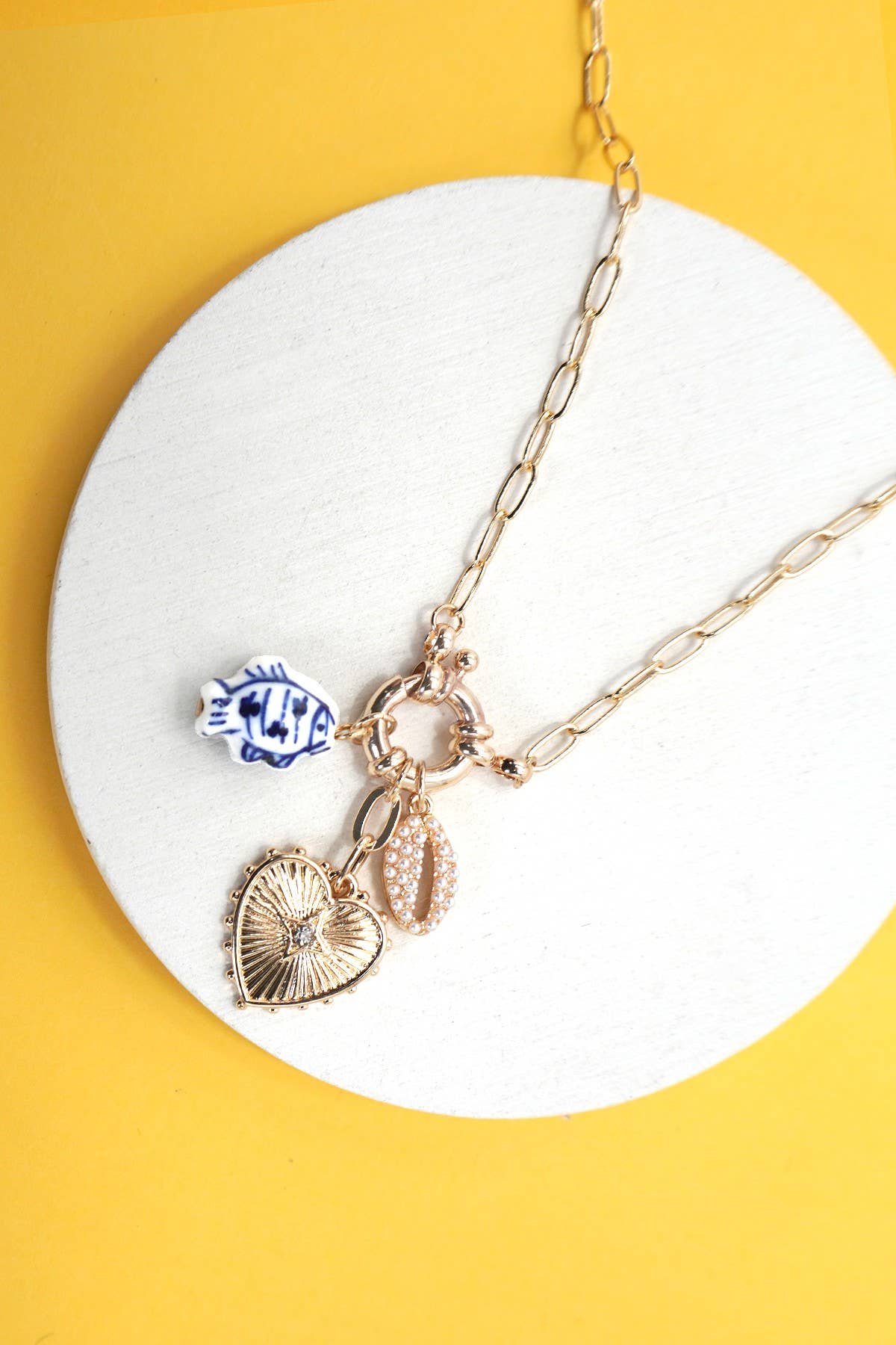 PORCELAIN TOILE FISH PUKA MULTI CHARM NECKLACE